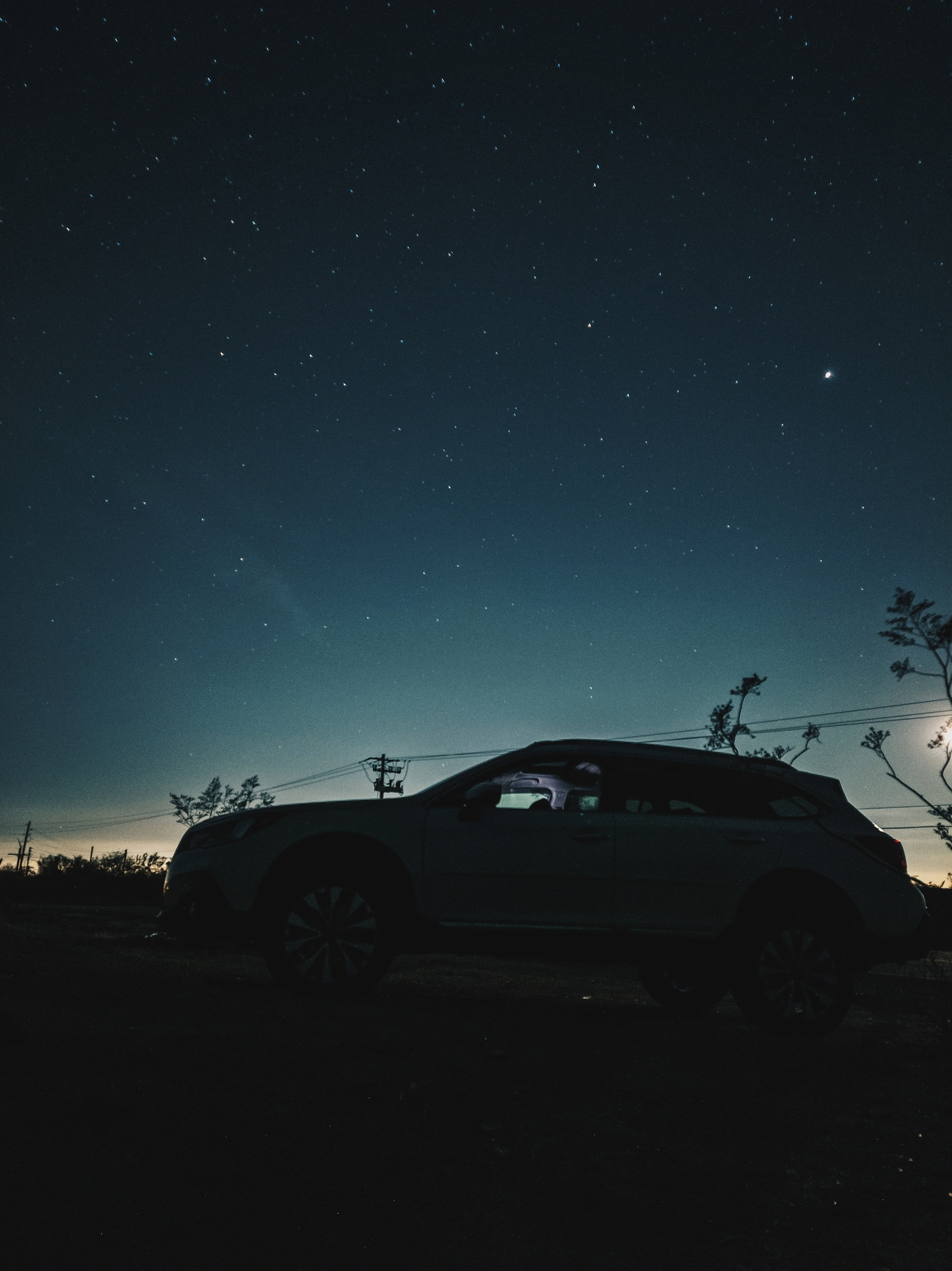 Long-exposure of vehicle with night sky. Near Superstition Mountains in Arizona.