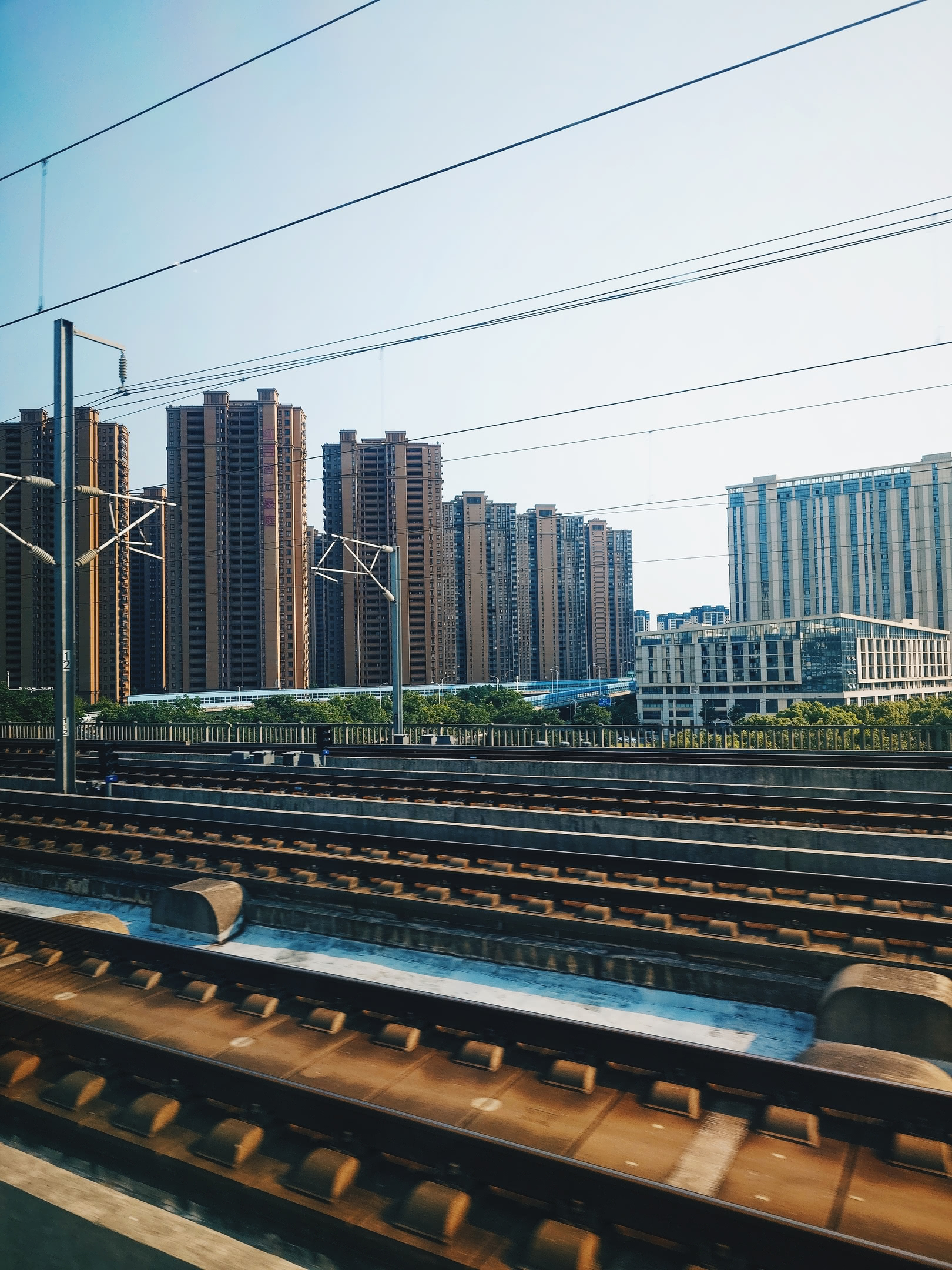 Apartment towers in the distance. Taken from the window of the high-speed train.