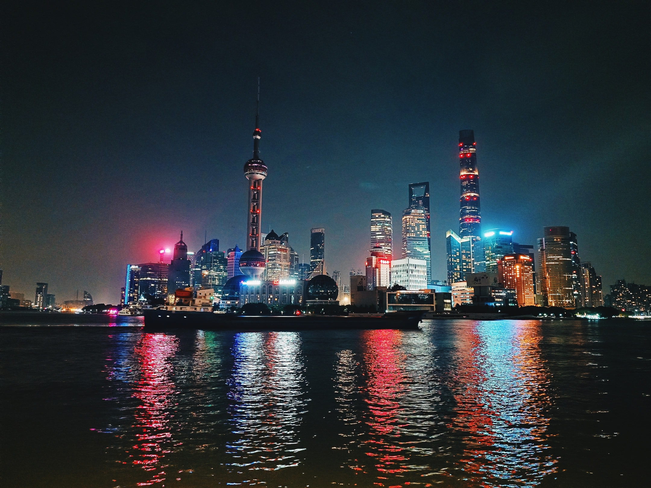 Lùjiāzuǐ skyscrapers at night. Taken from The Bund.