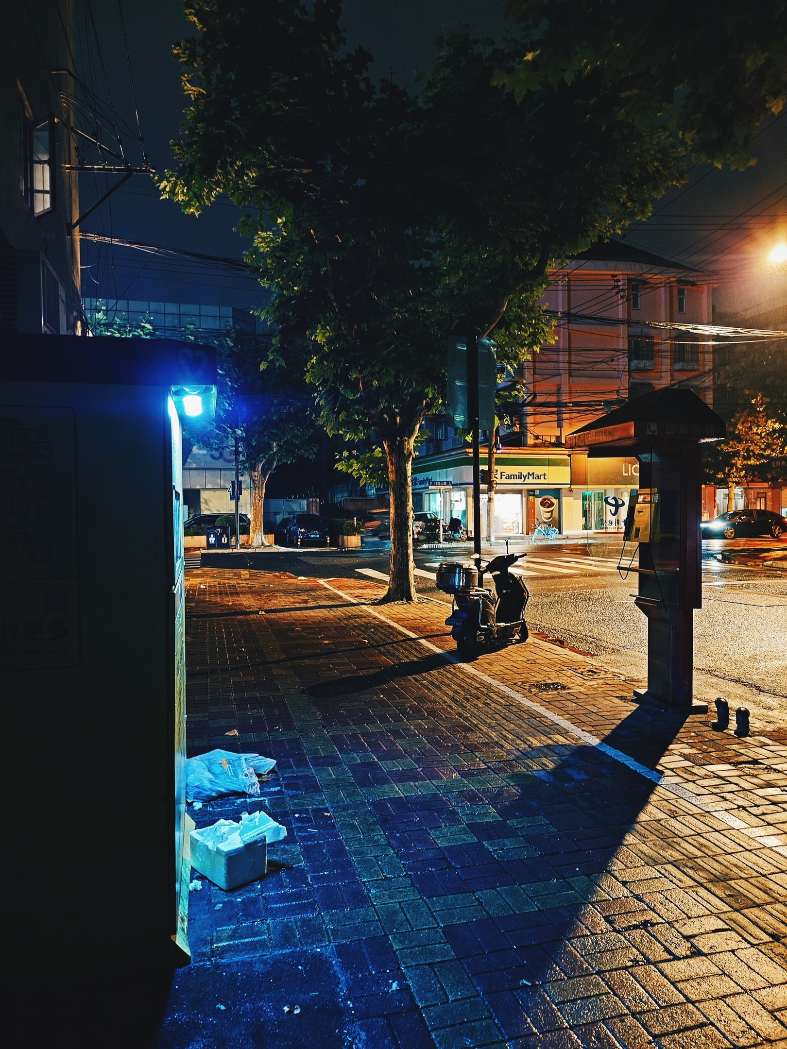 Empty side-walk before dawn. Where the ride-share driver dropped me off. FamilyMart in the distance.