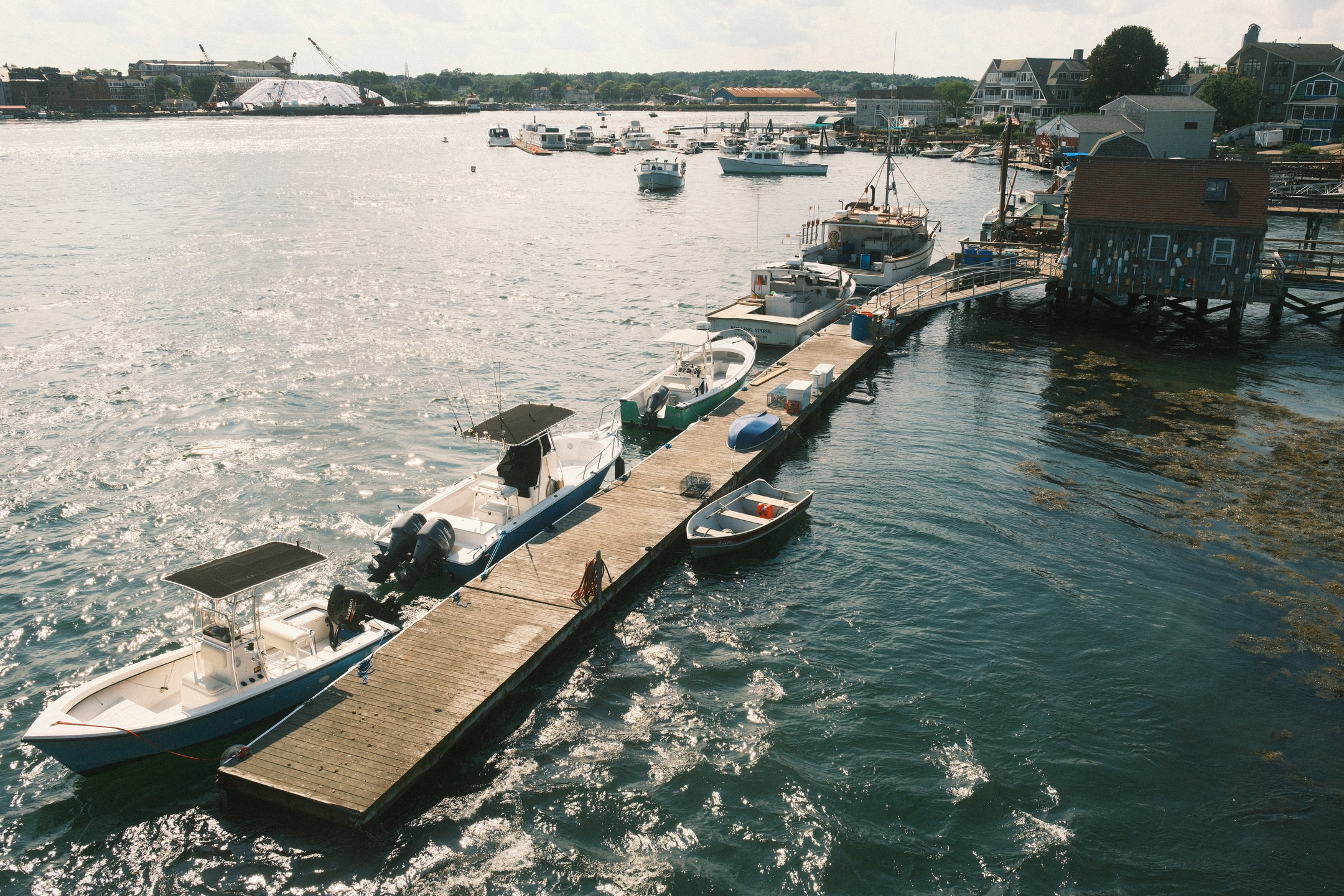 Boats tied up along a dock off Badgers Island.