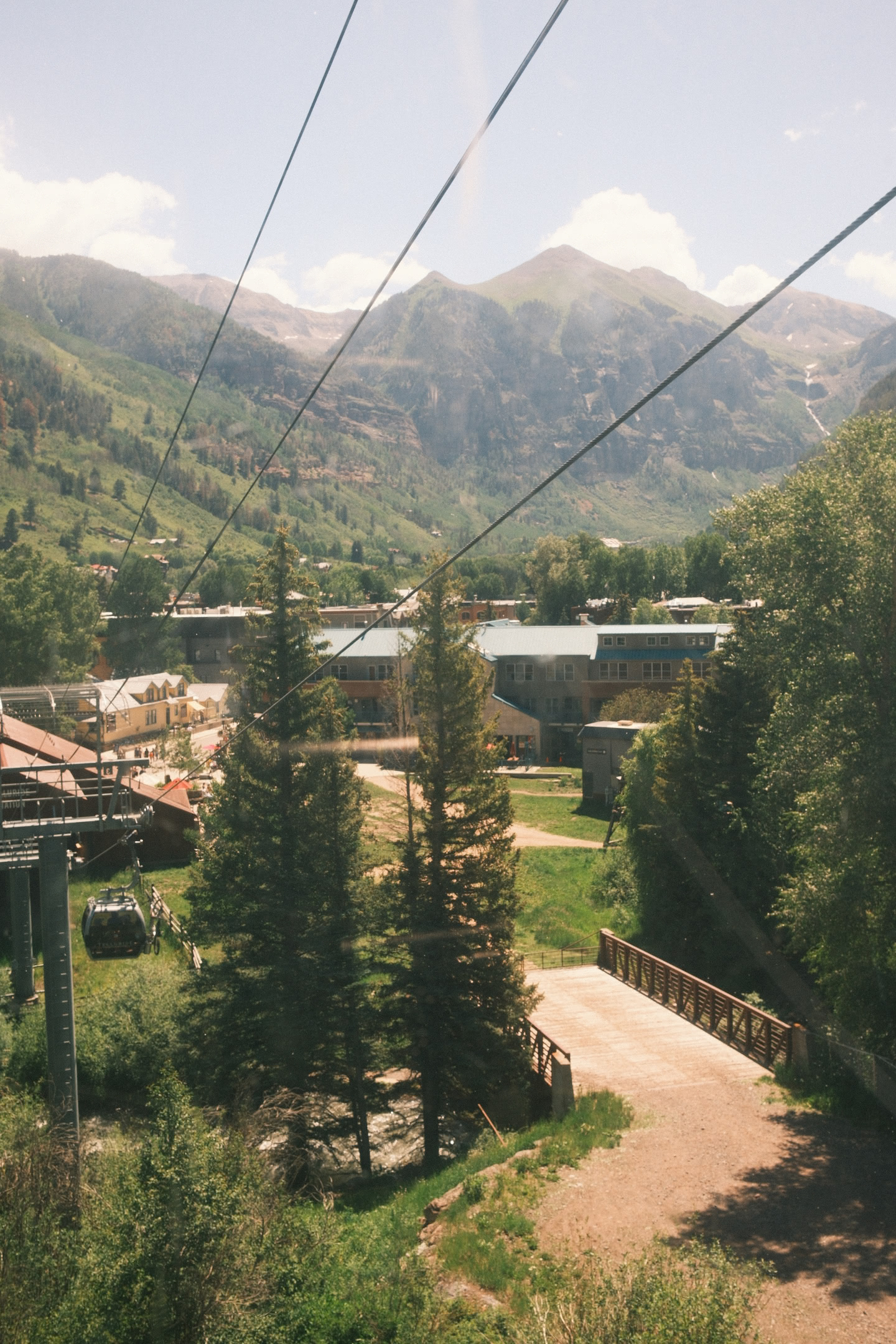 View from inside the gondola. The base of the town while ascending to the top.